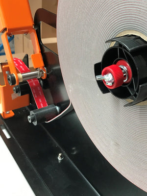 Tape Crew VHB Tape dispenser being used with 3M 4991 VHB Tape