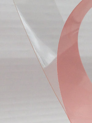 Tesa 4965 clear double sided tape with the red liner being removed