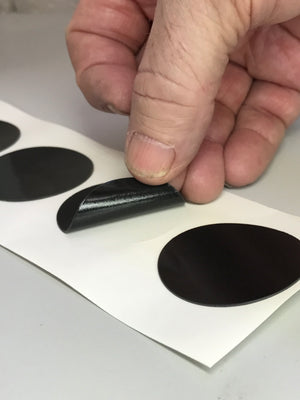 Kiss Cut on a roll (meaning the die cut shape is left on the roll with the unwanted material removed)