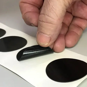 Kiss Cut on a roll (meaning the die cut shape is left on the roll with the unwanted material removed)