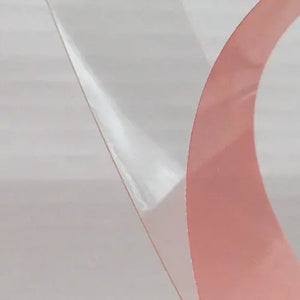 Tesa 4965  clear double sided tape with the red liner being removed